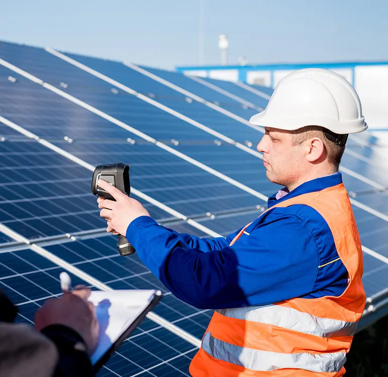 Engineer inspecting solar panels installation