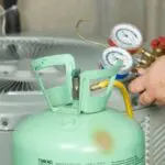 HVAC technician checking refrigerant levels